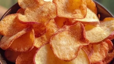 Air fryer apple chips with cinnamon sugar on a plate