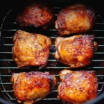 Delicious air fryer chicken thighs served with herbs and spices