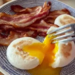 Delicious air fryer eggs served on a plate, showcasing a fluffy texture.