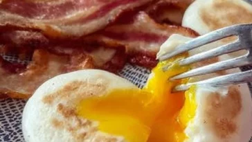 Delicious air fryer eggs served on a plate, showcasing a fluffy texture.