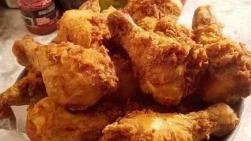 Crispy Air Fryer Fried Chicken on a plate garnished with herbs