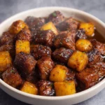 Air fryer garlic butter steak bites with crispy potatoes and herbs