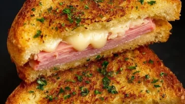 Delicious Air Fryer Grilled Ham and Cheese sandwich with melted cheese