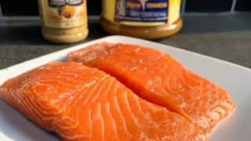 Air Fryer Honey Mustard Salmon served on a plate with vegetables