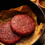 Delicious air fryer juicy burgers served on a plate with fresh toppings