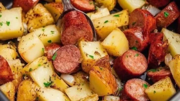 Crispy air fryer potatoes and sausage served on a plate