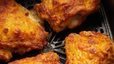 Crispy airfryer fried chicken served on a plate with dipping sauce