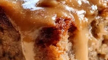 Delicious slice of Apple Dapple Cake with apples and walnuts.