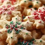 A plate of homemade soft Christmas cookies decorated with festive icing.