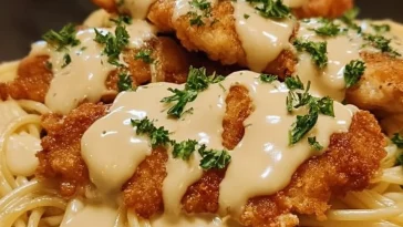 Cheesy Chicken Bites served with spaghetti in garlic parmesan sauce