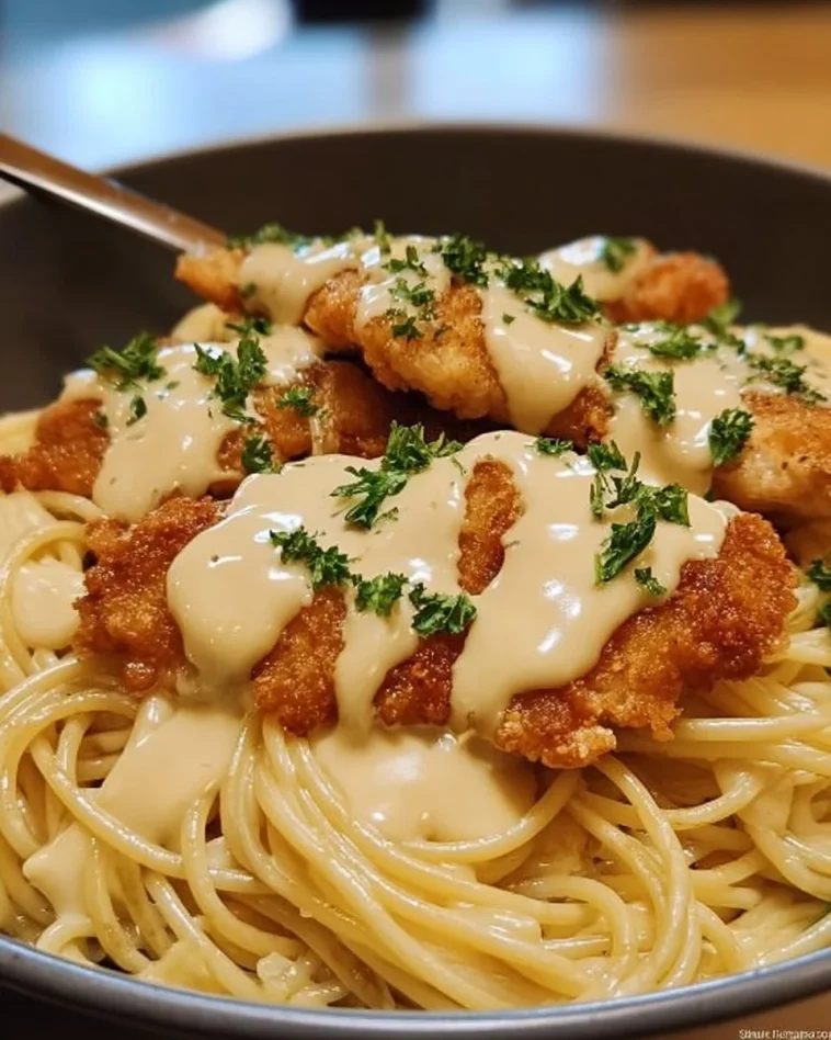 Cheesy Chicken Bites served with spaghetti in garlic parmesan sauce