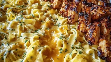 Cheesy garlic butter chicken fettuccine with creamy three-cheese sauce