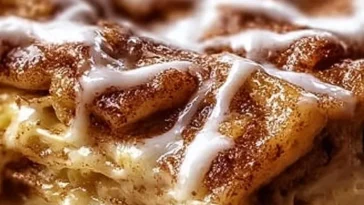 Delicious Cinnamon Roll Apple Lasagna layered with cinnamon rolls and apples