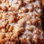 Slice of Amish apple fritter bread with apples and cinnamon glaze