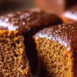 Delicious gingerbread cake topped with frosting and holiday decorations