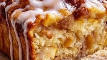 Freshly baked Amish apple fritter bread with apple chunks and glaze