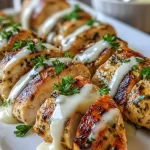 Oven-baked Caesar chicken with creamy Parmesan sauce served on a plate
