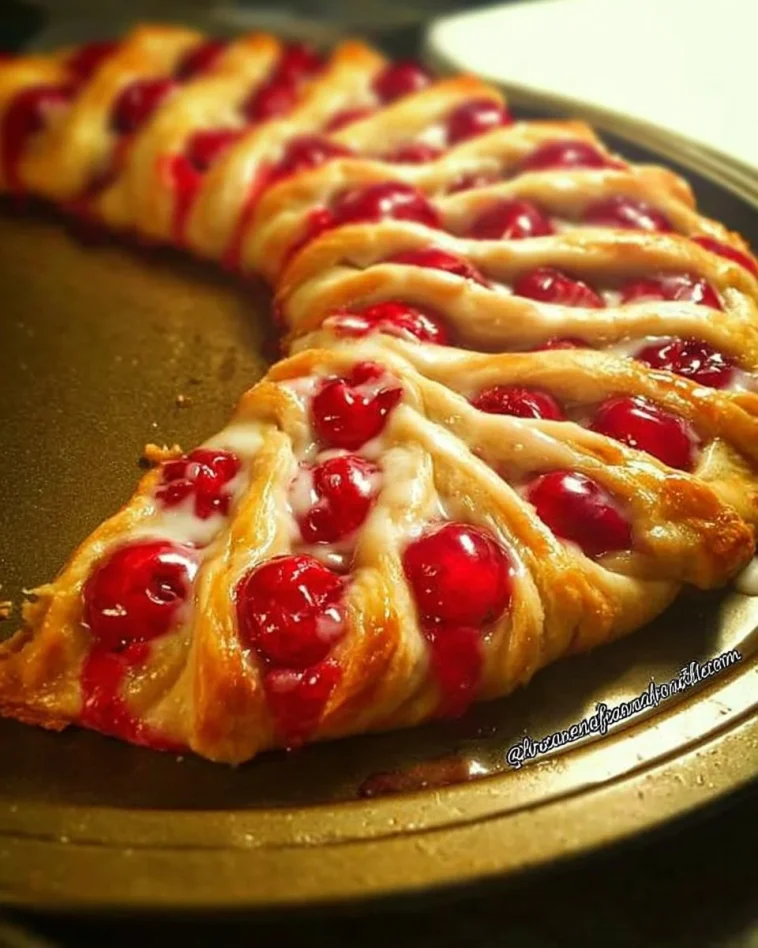 Festive Candy Cane Cheese Danish topped with peppermint and cream cheese filling