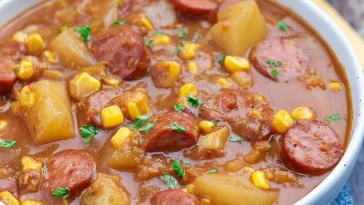 A bowl of hearty Cowboy Stew filled with meat and vegetables.