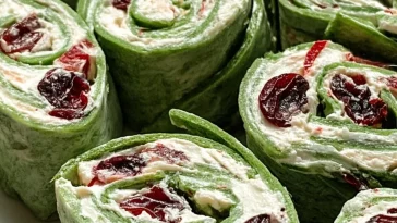 Cranberry Jalapeño Pinwheels on a platter, showcasing vibrant colors and textures.