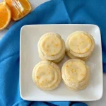 Freshly baked Orange Meltaway Cookies on a cooling rack