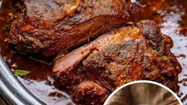 Mom's Sunday Roast with rich gravy and tender, juicy meat.