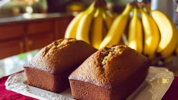 Warm, freshly baked banana bread with a golden, inviting crust.