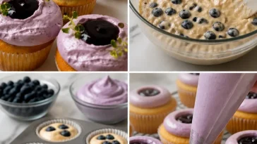 Triple Blueberry Cupcakes topped with creamy frosting and fresh blueberries